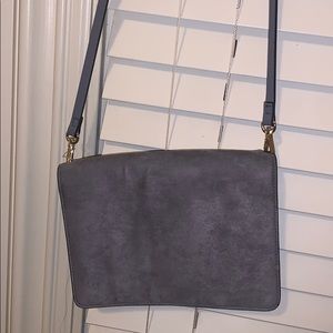 violet colored hand bag